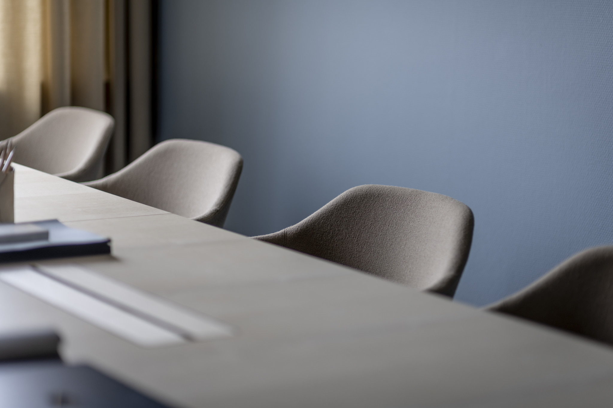 A meeting room at Diadrom's offices, chairs along a light wood table